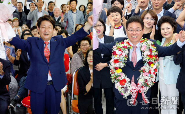 권영진 자유한국당 대구시장 당선인이 13일 밤 대구 수성구 범어동 선거 사무실에서 꽃다발을 들고 기뻐하고 있다. 우태욱 기자 woo@msnet.co.kr