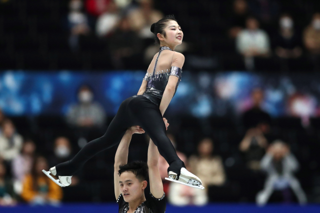 SAITAMA, JAPAN - MARCH 20, 2018: Figure skaters Kim Ju Sik and Ryom Tae Ok of North Korea perform during the pairs\